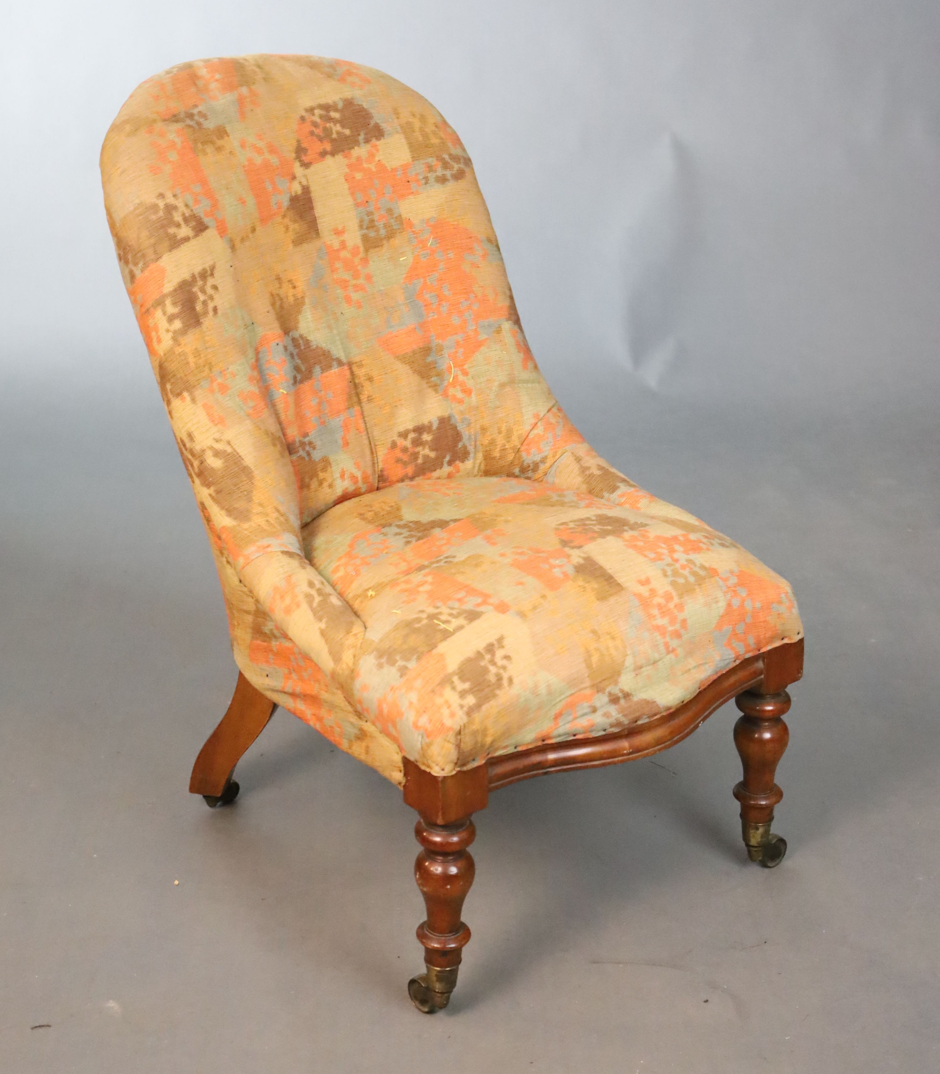 A Victorian walnut nursing chair, W.51cm D.76.5cm H.84cm